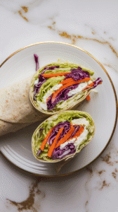 a sliced cottage cheese and slaw wrap on a white plate, colorful filling visible, wrap folded neatly