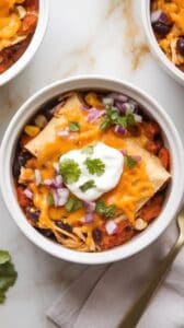 Smoky Cheddar Crockpot Chicken Enchilada Casserole